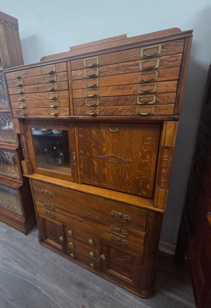 Antique Oak Specimen/Filing Cabinet with Twelve Card-Label Drawers: Antique quartersawn oak specimen or filing cabinet, twelve shallow drawers across the top each with a brass card-holder pull, a glazed cabinet door and a quartersawn oak cabinet door below the drawers