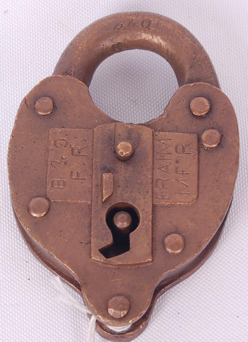 Baltimore and Ohio brass Fraim railroad lock: Baltimore and Ohio brass Fraim railroad lock Baltimore and Ohio brass heart shaped Fraim railroad lock. Stamped with B&O R.R. and FRAIM MF'R on the front of the body. B&O stamped on the clasp. No key.
