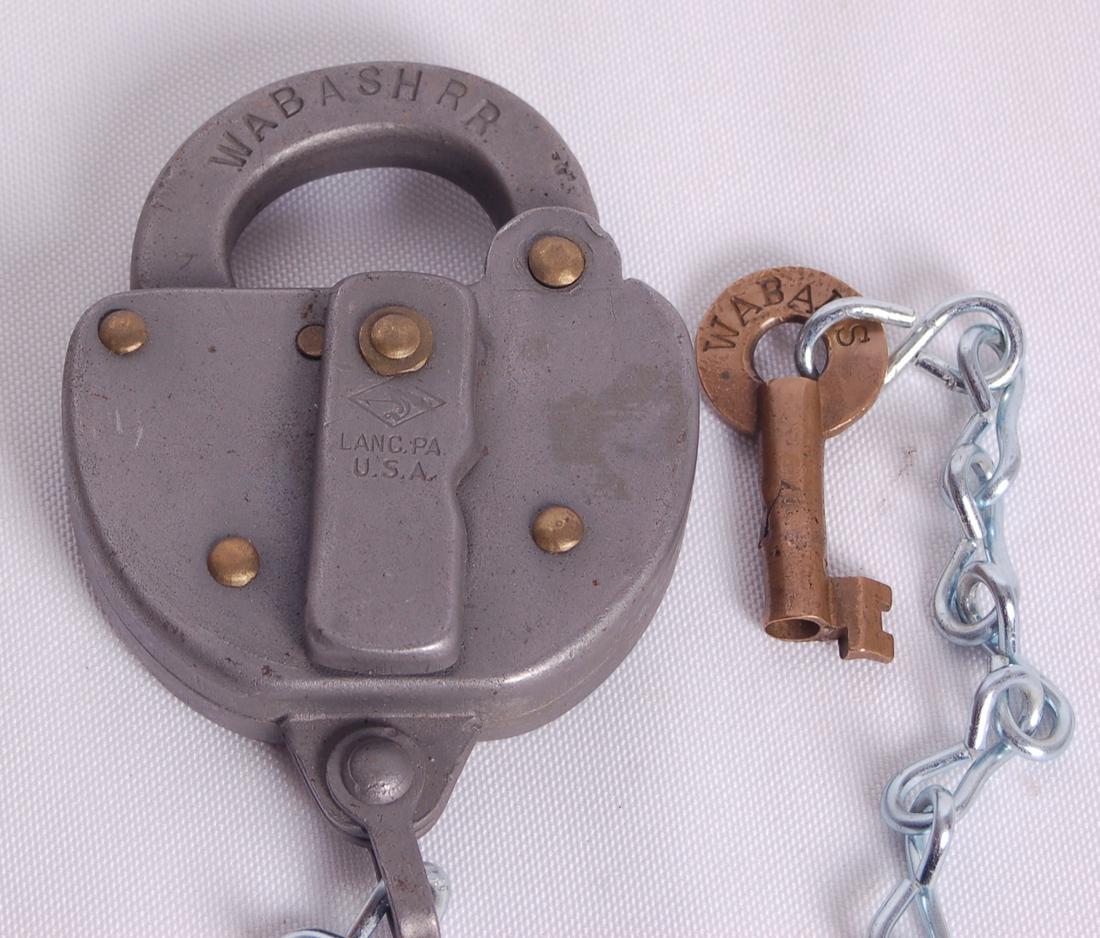 Wabash Railroad Slaymaker Switch Lock w/ Key: Wabash Railroad Slaymaker Switch Lock w/ KeyWabash Railroad Slaymaker Switch Lock w/ Key. Lock stamped with Wabash RR on the clasp w/ Lanc. PA U.S.A. on the key cover. Reverse of the clasp stamped wit
