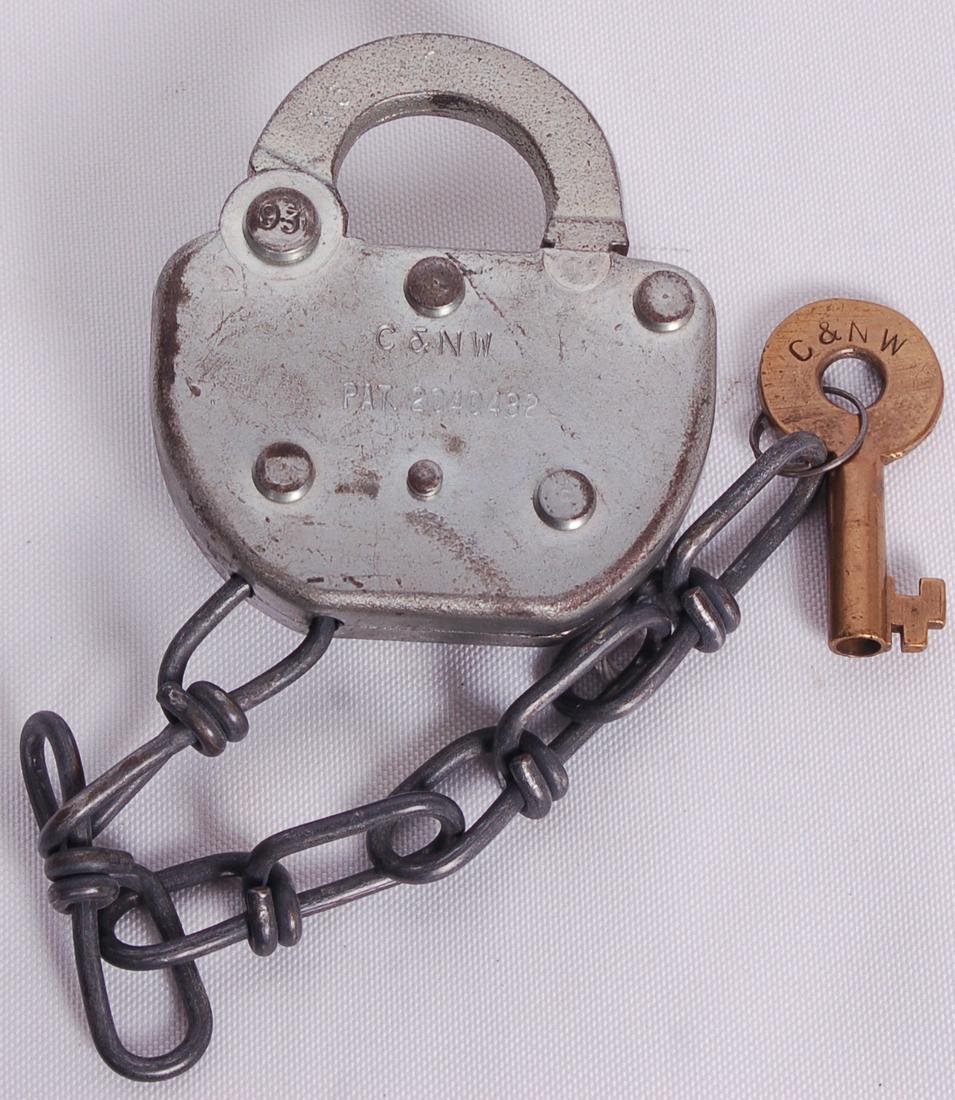 Adlake Chicago and Northwestern Railroad Switch Lock w/: Adlake Chicago and Northwestern Railroad Switch Lock w/ KeyAdlake Chicago and Northwestern Railroad Switch Lock w/ Key. Body of the lock stamped w/ C&NW and the patent number. Key cover is embossed w/