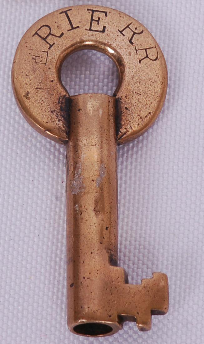 Erie Railroad Slaymaker Switch Lock Key: Erie Railroad Slaymaker Switch Lock KeyErie Railroad Slaymaker Switch Lock Key. The letter "E" in the stamped ERIE RR on the front of the key is about 60% worn away. The reverse of the key i