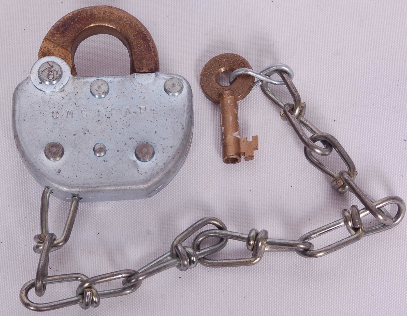 Adlake Milwaukee Road Railroad Switch Lock and Key: Adlake Milwaukee Road Railroad Switch Lock and KeyAdlake Milwaukee Road Railroad Switch Lock and Key. Steel bodied lock with Adlake embossed key cover and CMSTP&P stamped on the lock body. The key is