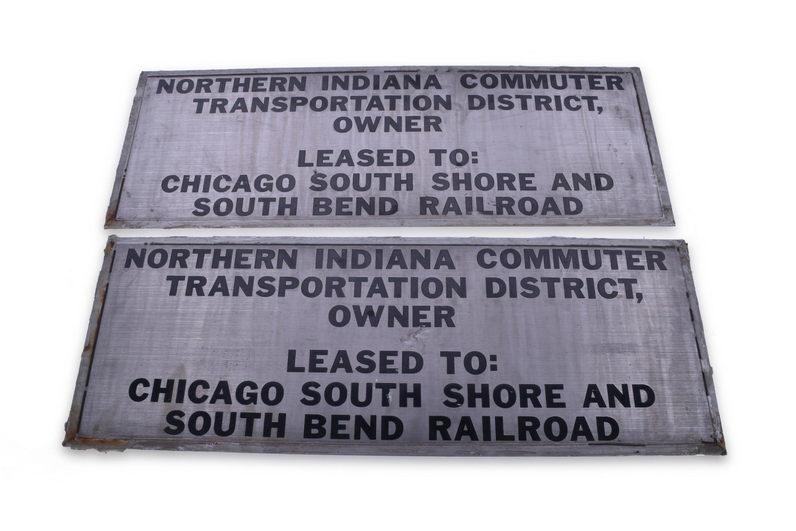 Chicago, South Shore, & South Bend Railroad / NICTD: Chicago, South Shore, & South Bend Railroad / NICTD Nippon Sharyo Commuter Car #4 Pair of Stainless Steel Lessor Plates Plates both measure 27" x 9 3/4" Plates are stainless steel with etched black le
