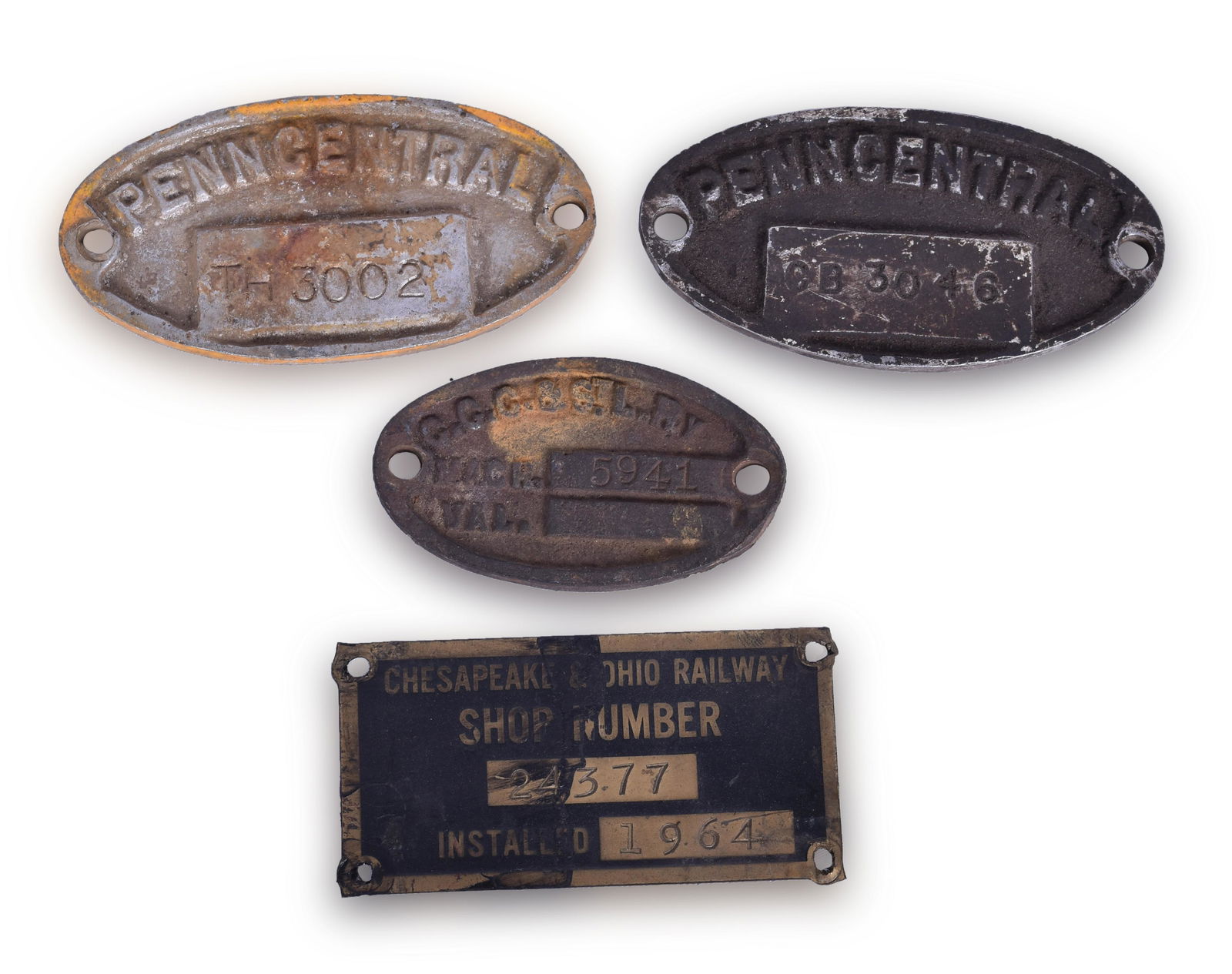 Four Railroad Shop Number Plates; Big Four, Chesapeake: Four Railroad Shop Number Plates; Big Four, Chesapeake and Ohio, and Penn Central Group includes 3 5/8" x 1 13/16" Chesapeake and Ohio brass plate with shop number 24377 and an install date of 1964. B