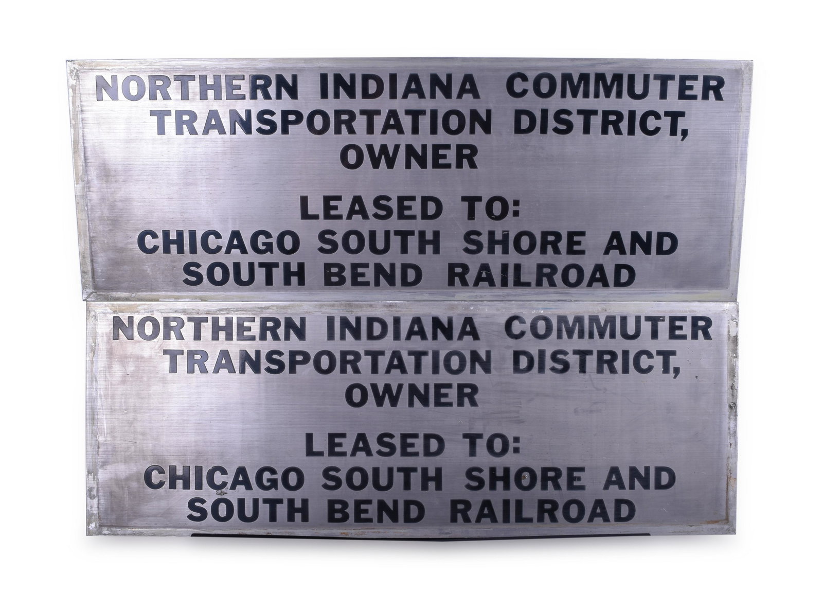 Chicago, South Shore, & South Bend Railroad / NICTD: Chicago, South Shore, & South Bend Railroad / NICTD Nippon Sharyo Commuter Car #10 Pair of Stainless Steel Lessor Plates Plates both measure 27" x 9 3/4" Plates are stainless steel with etched black l