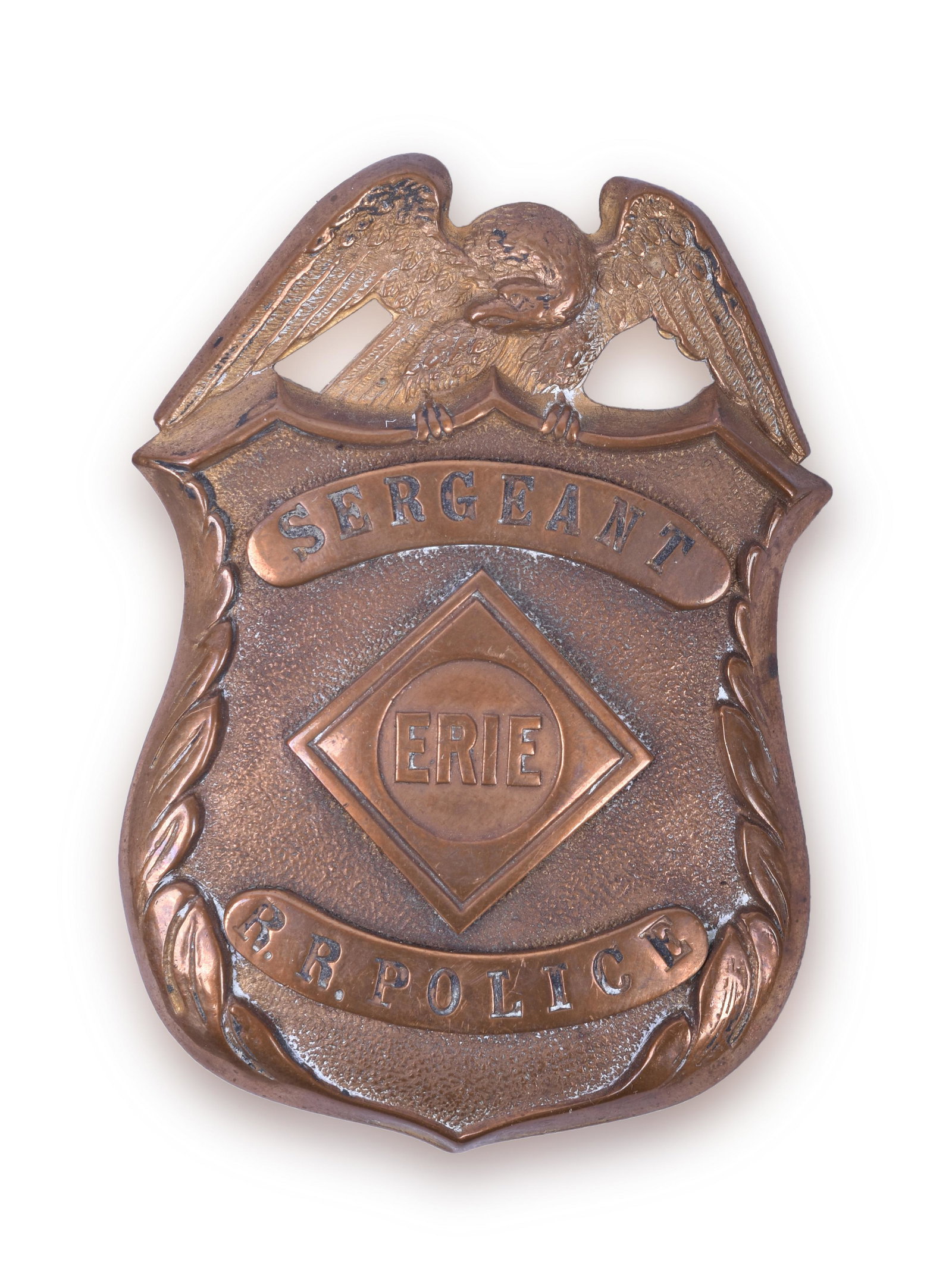 Erie Railroad Sergeant Police Breast Badge: Erie Railroad Sergeant Police Breast Badge Black enameled lettering background. The lettering is Serif font and the badge is shield style with the perched Eagle on the top of the shield. Open holes be