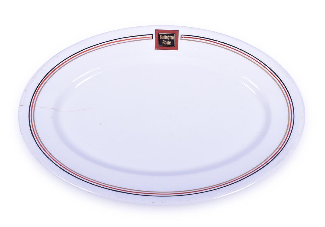 Syracuse Burlington / CB&Q Aristocrat 12 1/2" Serving: Syracuse Burlington / CB&Q Aristocrat 12 1/2" Serving Platter Platter has a 3" crack on the left side. Good pin stripes and herald. A few very minor nicks noted in the pinstripes. Platter is back stam