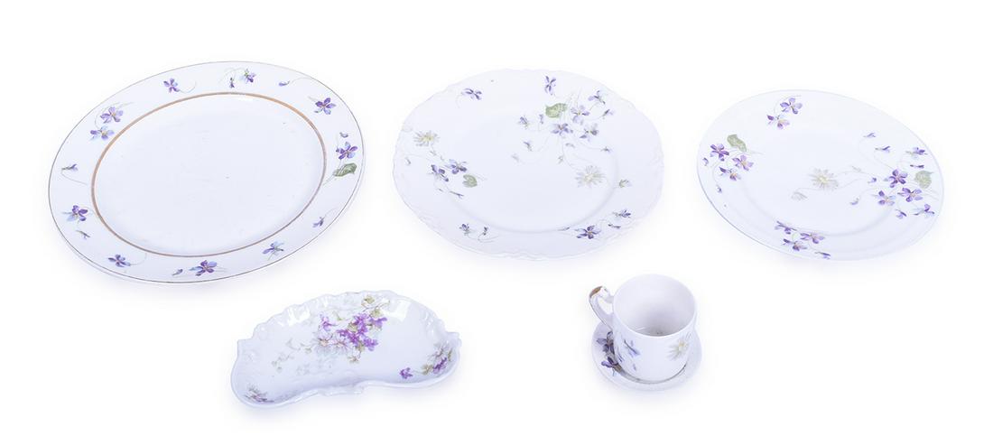 Six Pieces of Haviland Violets and Daisies China: Six Pieces of Haviland Violets and Daisies China Group includes demitasse with worn gold on handle, 3" butter chip, 6" kidney shaped serving bowl, 7 1/2" plate with one minor chip in the rim, 8 1/2" p