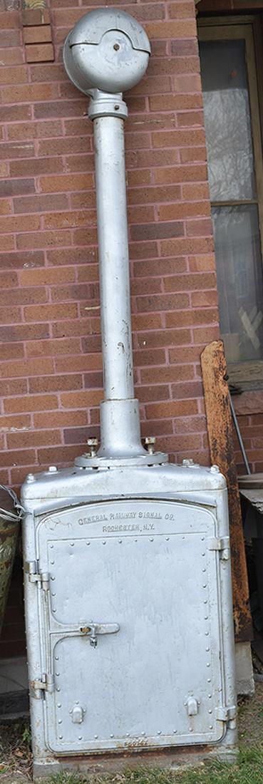 General Railway Signal Company Case w/ Pole & Bell: General Railway Signal Company Case w/ Pole & Bell Stripped down GRS case with mast and bell. Last in service on the Union Pacific Railroad around 1994. Sold as is shown in the photos. The signal is a