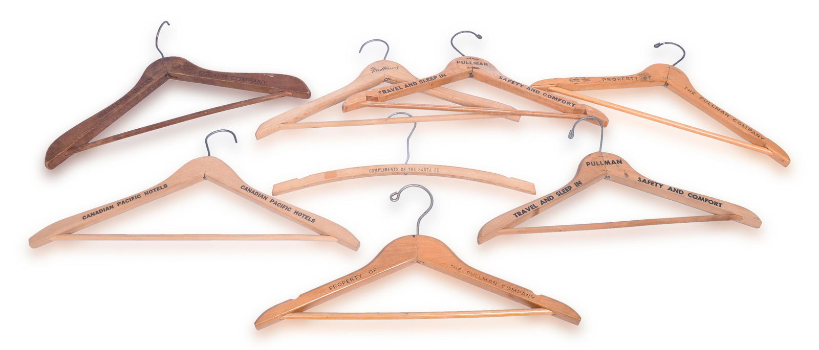 Group of Eight Railroad Issued Clothes Hangers - Pullman, Fred Harvey, Western Union, Canadian: Group of eight railroad issued wooden clothes hangers. Includes four Pullman, Fred Harvey, Western Union, Canadian Pacific, Santa Fe. All in good condition. See photos for best description.