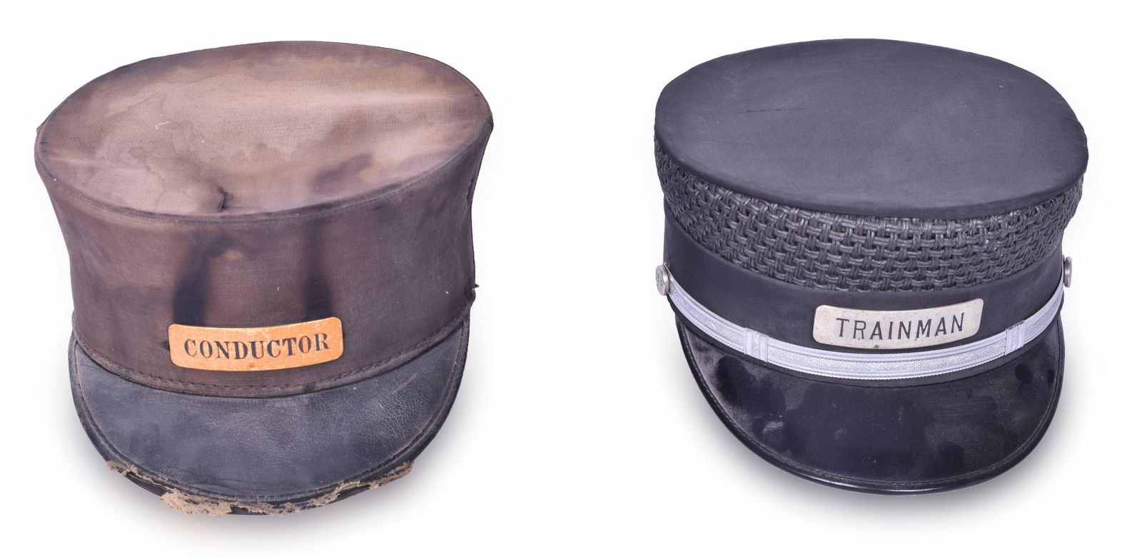 Pair of Price Uniform Railroad Caps - Trainman and Conductor: Pair of Price Uniform railroad caps. Both black, one with Conductors badge, the other with Trainman badge. Both have black enamel lettering. The conductors hat is worn, but the Trainman hat is in good