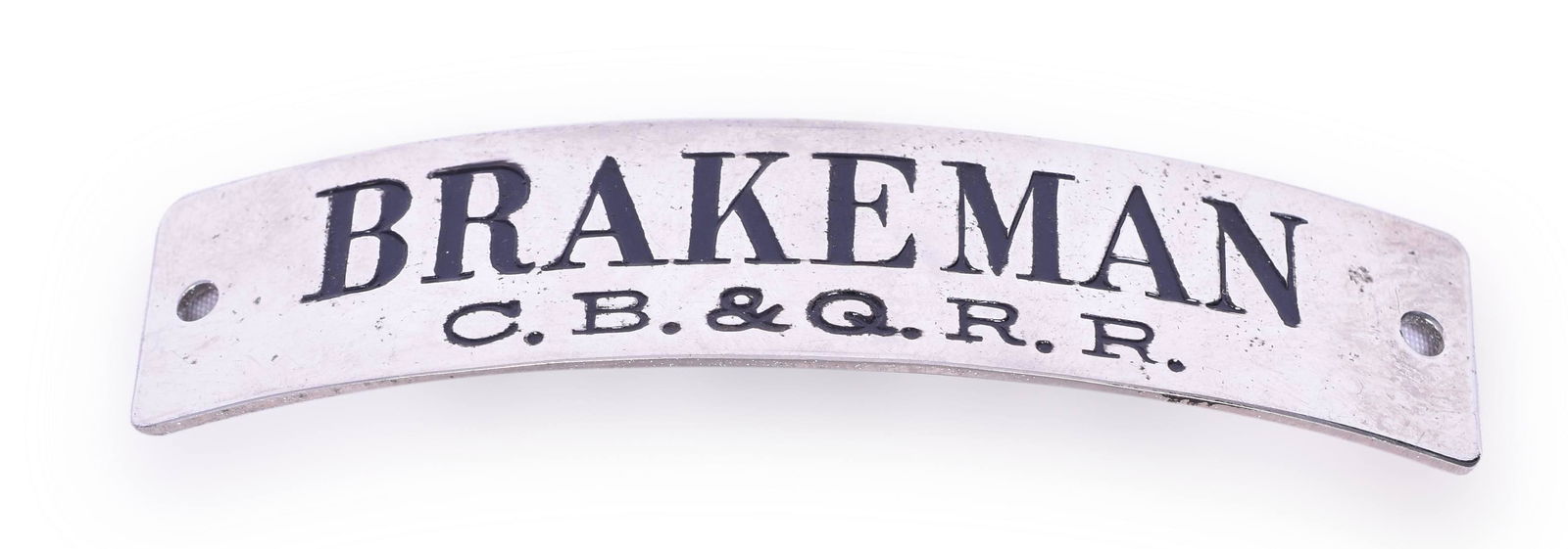 CB&Q / Burlington Brakeman Nickel Cap Badge: Nickel cap badge marked Brakeman C.B.&Q. R.R. and has black enamel background lettering with holes for brad attachment. Strong enamel lettering.