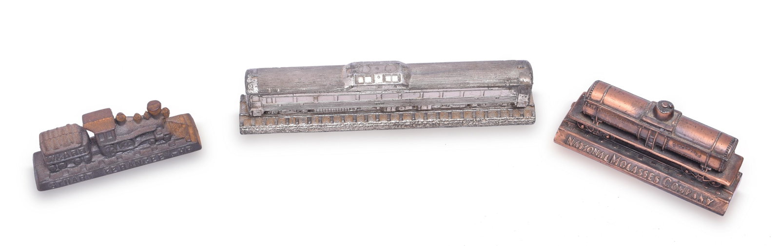 Three Railroad Paperweights - Budd RDC, National Molasses Company, Stuart Ferangee: Group of three railroad paperweights including Budd RDC car marked RDC-1 has some plating wear. National Molasses Company tank car, and Stuart Ferangee locomotive (This appears to be a newer reproduct