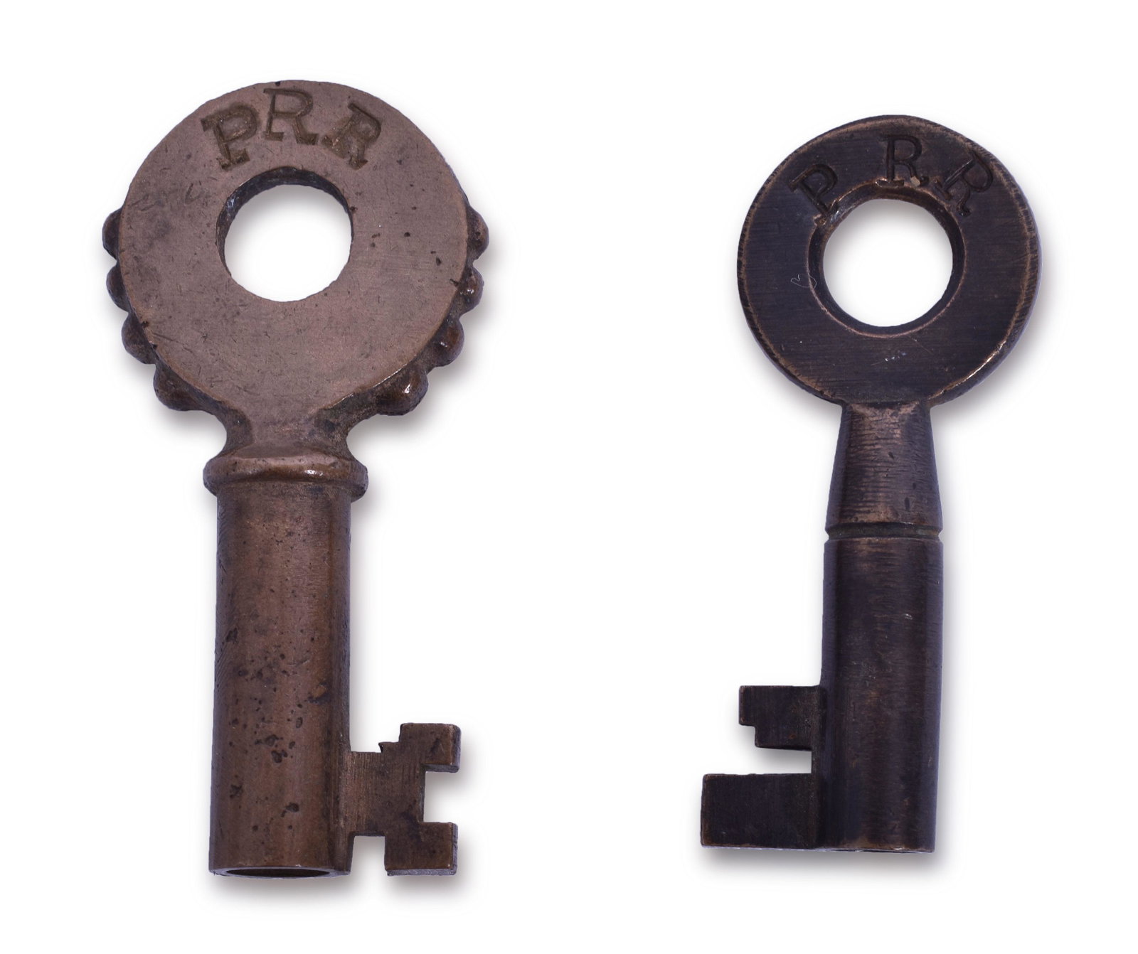 Pennsylvania Railroad Keys - Knobby Hilt F-S and Tapered Barrel Single Ring: Pair of Pennsylvania Railroad keys. Includes knobby hilt stamped with PRR in serif font and F-S Hardware mark on the reverse. The second key is a tapered barrel single ring stamped with PRR in serif f