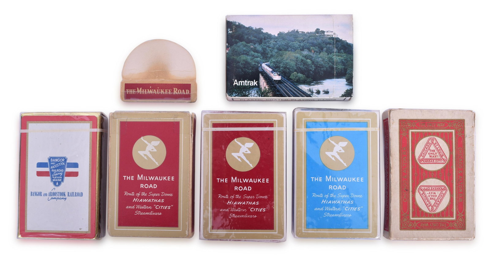 Six Decks of Railroad Playing Cards - Early Chicago and Alton, Sealed Milwaukee Road and Bangor and: Group of railroad playing cards including an early deck of Chicago and Alton with the Ace coded J1914, sealed Bangor and Aroostook, sealed Milwaukee Road, Milwaukee Road with detached top, second seal