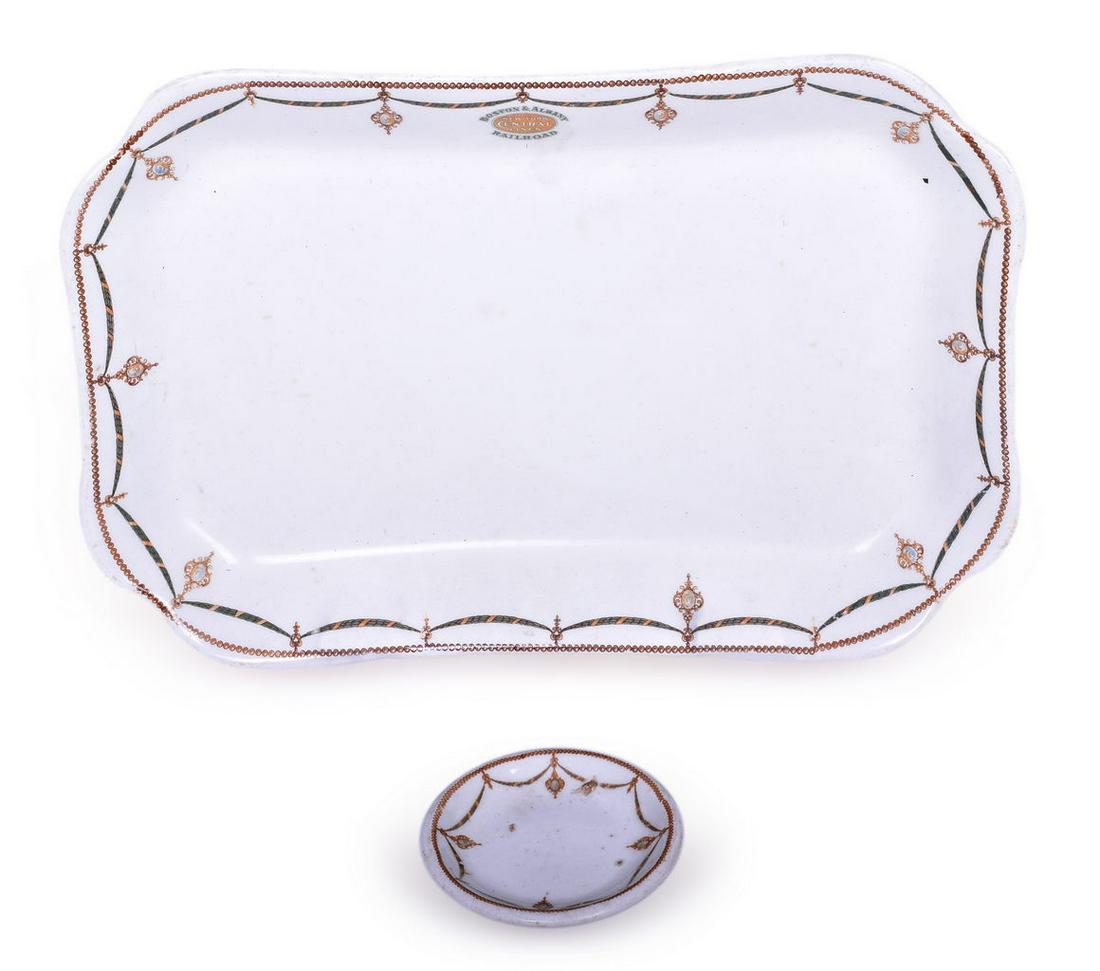 New York Central Lines Boston & Albany Railroad Berkshire Rectangular Platter & Butter Pat: A pair of railroad dining china pieces for Boston & Albany Railroad in the Berkshire pattern. The rectangular platter measures 12 1/4" x 8 1/4" and is top marked with the Boston & Albany Railroad surr
