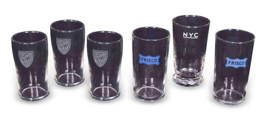 Six Railroad Drinking Glasses - Delaware & Hudson, Frisco, and New York Central: A small group of six drinking glasses including three 4 1/2" glasses for the Delaware & Hudson Railroad with the shield logo etched on the side. Two 4 3/4" glasses with the blue Frisco logo applied to