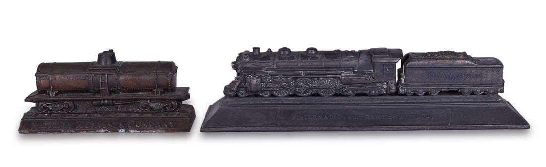 New York Central Hudson and National Molasses Company Railroad Advertising Paperweights: Pair of railroad advertising paperweights. Includes New York Central Hudson locomotive marked with International Carriers, LTD / Calvin Bullock. The end is marked 1928 by Ban Gytenbeek Sales. The seco