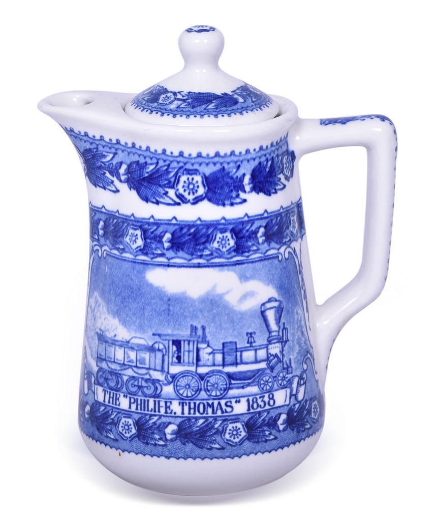 Baltimore and Ohio Railroad China Centenary Lidded Chocolate Pot: A 6" china chocolate pot with lid for the Baltimore & Ohio Railroad in the Centenary pattern, bottom stamped 1827-1927 Baltimore & Ohio Railroad Shenango China 52. The piece shows general signs of use