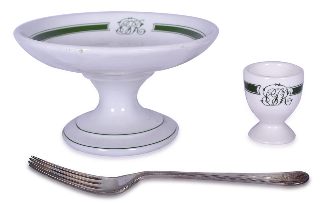 Canadian Pacific Railway Green Band China Pedestal Compote, Egg Cup, and Silver Fork: Three dining car items for the Canadian Pacific Railroad including a 6 1/2" x 3 1/2" pedestal compote in the Green Band pattern, top marked with the entwined CPR, and bottom stamped Grindley Hotelware