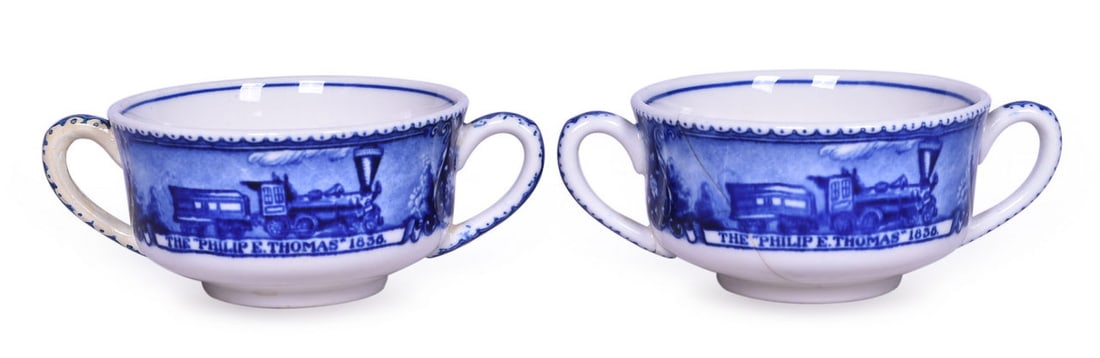 Pair of Baltimore and Ohio Railroad China Centenary Double Handled Cups: Pair of Baltimore and Ohio Railroad China Centenary Double Handled Cups A pair of double handled china cups for the B&O Railroad in the Centenary pattern with a side graphic of Philip E. Thomas and Ho