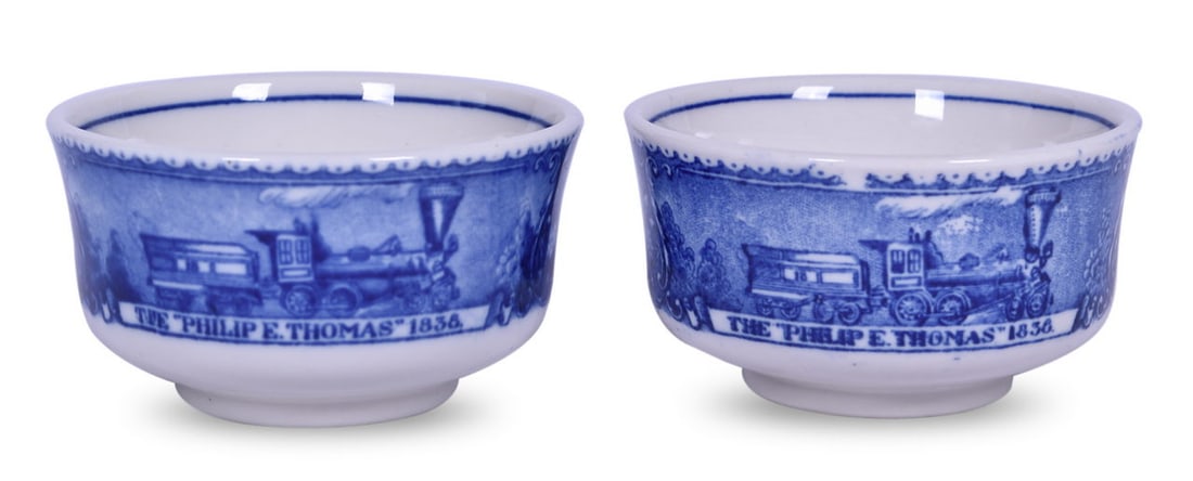 Pair of Baltimore & Ohio Railroad China Centenary Blue Line Bouillon Cups: A pair of 3 3/4" china bouillon cups for the B&O Railroad in the Centenary pattern with the blue line, bottom stamped 1827-1927 Baltimore & Ohio Railroad Scammell's Lamberton China Design Patented. Th