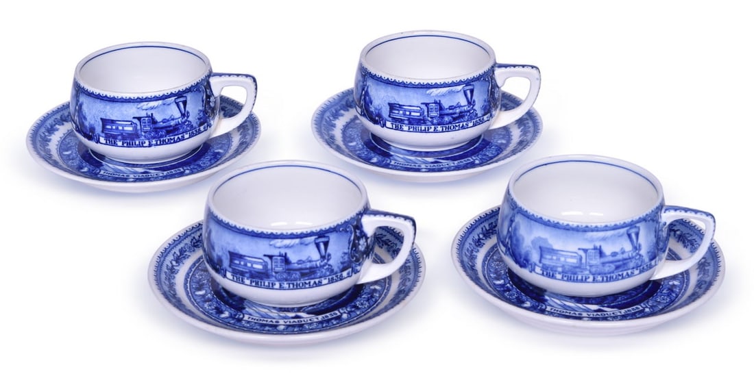 Four Baltimore & Ohio Railroad China Centenary Blue Line Cup and Saucer Sets: Four blue line squat style cup and saucer sets for the Baltimore & Ohio Railroad in the Centenary pattern, including three early Patent Applied For pieces. Four cups measure 3 3/4" x 2 1/8" tall. One 