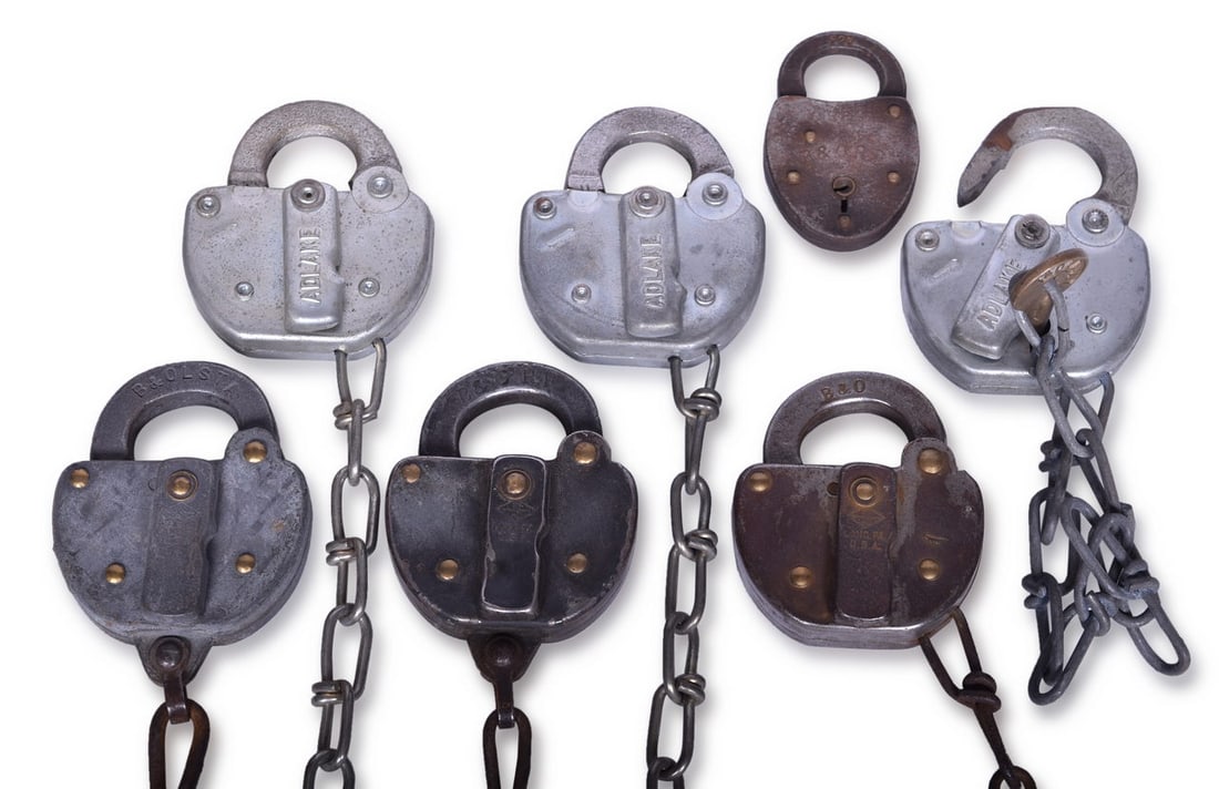 Group of Seven Baltimore and Ohio Railroad Locks - Rip Track, Station, etc.: Group of seven Baltimore and Ohio railroad locks including steel bodied Slaymaker Rip Track lock, shackle stamped B&O RR in serif font, reverse stamped 1956 RT, Slaymaker steel body with shackle stamp