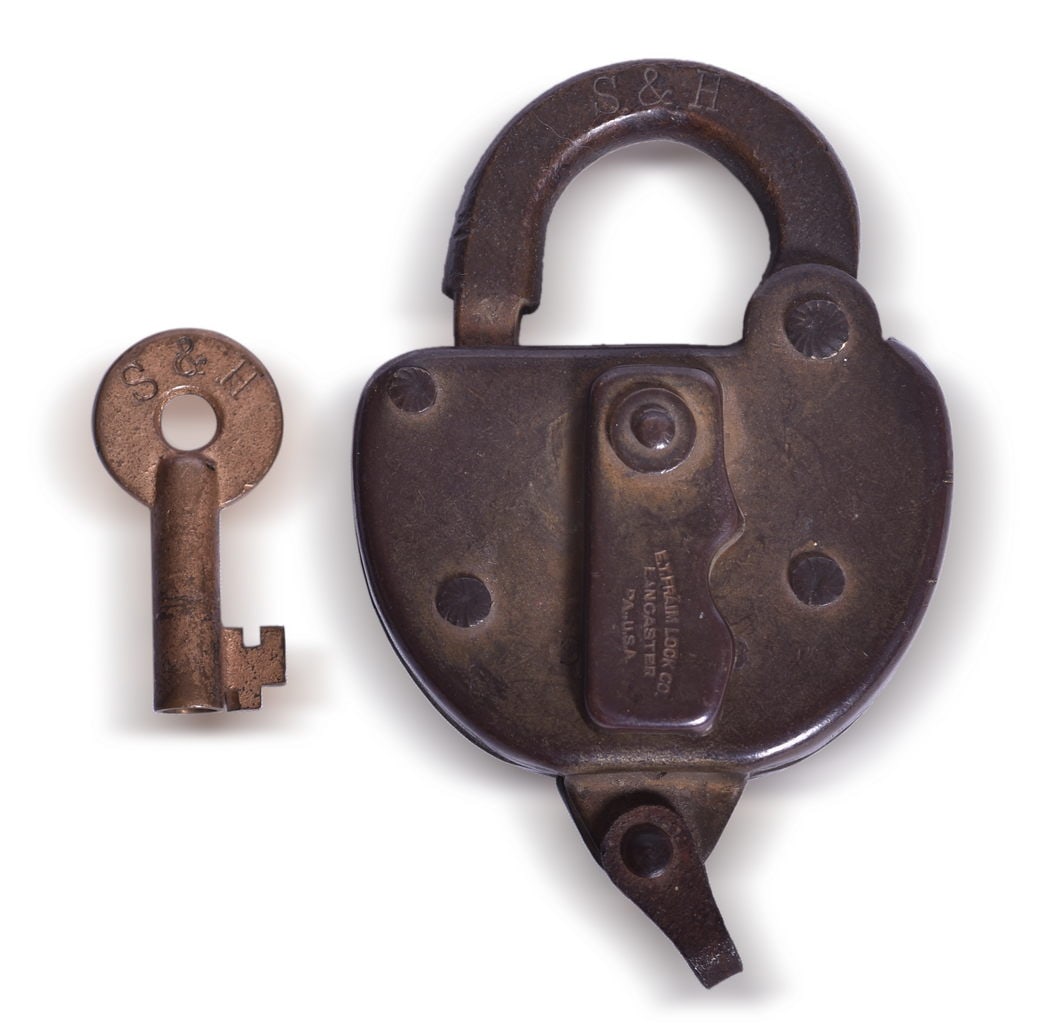 Steelton & Highspire Railroad Brass Key and Fraim Lock: A lock and key pair marked for the Steelton & Highspire Railroad. The brass key is stamped S&H in serif font on the front and on the back appears to be a stamped J. The key shows strong lettering but 