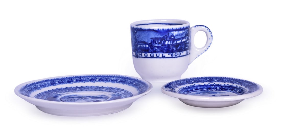 Baltimore and Ohio Railroad China Centenary Hot Chocolate Cup, Saucer, and Butter Pat: A group of china for the B&O Railroad in the Centenary pattern, all bottom stamped with the 1828-1927 Baltimore & Ohio Railroad Scammell's Lamberton China Design Patented mark. The early blue line hot