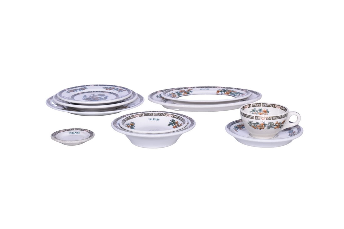 Ten Pieces of Pullman and Unmarked Indian Tree China - Butter Pat, Plates, Oval Platters, Fruit: A mixed group of Indian Tree pattern china including six Pullman Railroad marked Syracuse pieces, one with the Indian Tree graphic in the center. Includes a 9" Indian Tree dinner plate dated N-5 showi