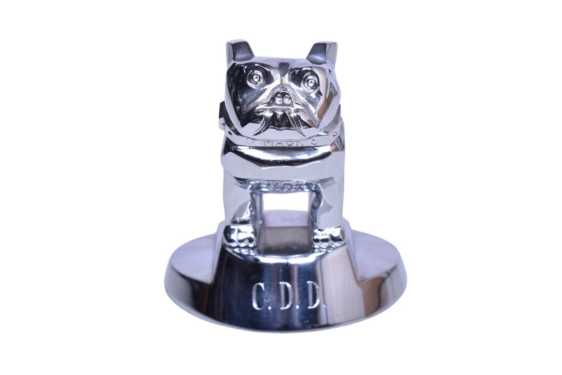 Mack Truck Chrome Bulldog Hood Ornament / Paperweight: Mack Truck Chrome Bulldog Hood Ornament / PaperweightMack trucks bulldog chrome hood ornament / desk paperweight. The front has been etched with C.D.D. on the base. The part number under the felt on t