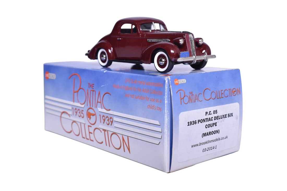 Brooklin PC05 1936 Pontiac Deluxe Six Coupe: Brooklin PC05 1936 Pontiac Deluxe Six Coupe Brooklin white metal 1:43 scale PC05 1936 Pontiac Deluxe Six Coupe in maroon. Original box, bag, and foam, missing hood ornament. Box size 8" x 8" x 4"