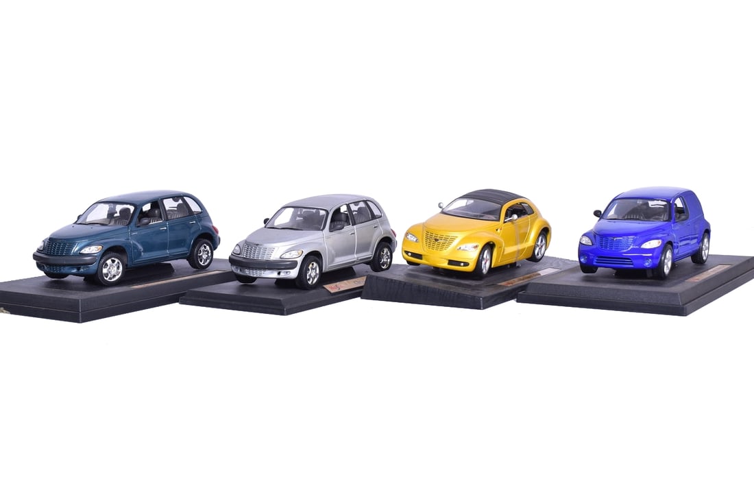 Four Maisto 1:18 Die Cast Chrysler P T Cruisers: Four Maisto 1:18 Die Cast Chrysler P T Cruisers Group includes a concept Chrysler Pronto cruiser and three standard production P T cruisers. Boxes have wear and are missing original packing materials.