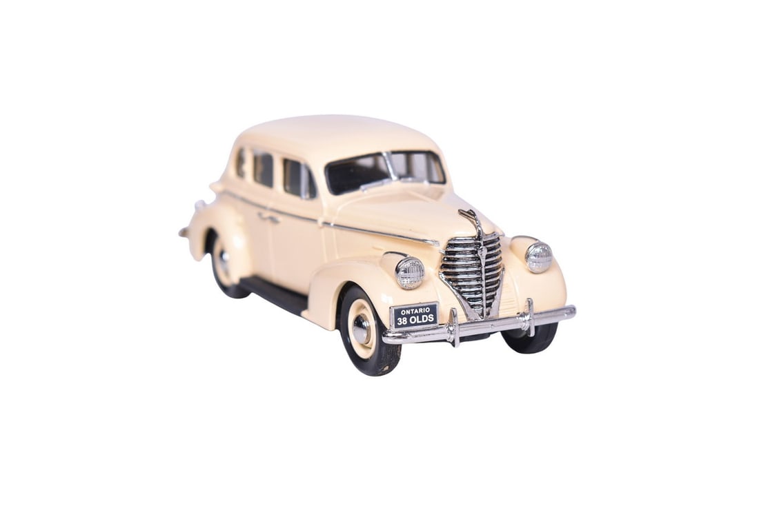 Durham Classics 1938 Oldsmobile: Durham Classics white metal 1:43 scale 1938 Oldsmobile in cream. Car numbered 1 of 250. Car does not come with original packaging, like new condition.
