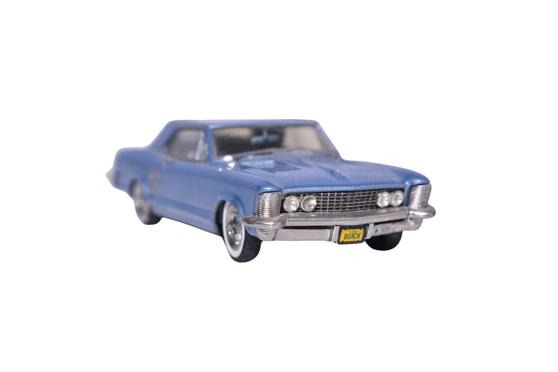 Mini Marque 1960s Buick Riviera: Mini Marque white metal 1:43 scale 1960s Buick Riviera in metallic blue. Car does not come with original packaging, missing side mirror and radio antenna.