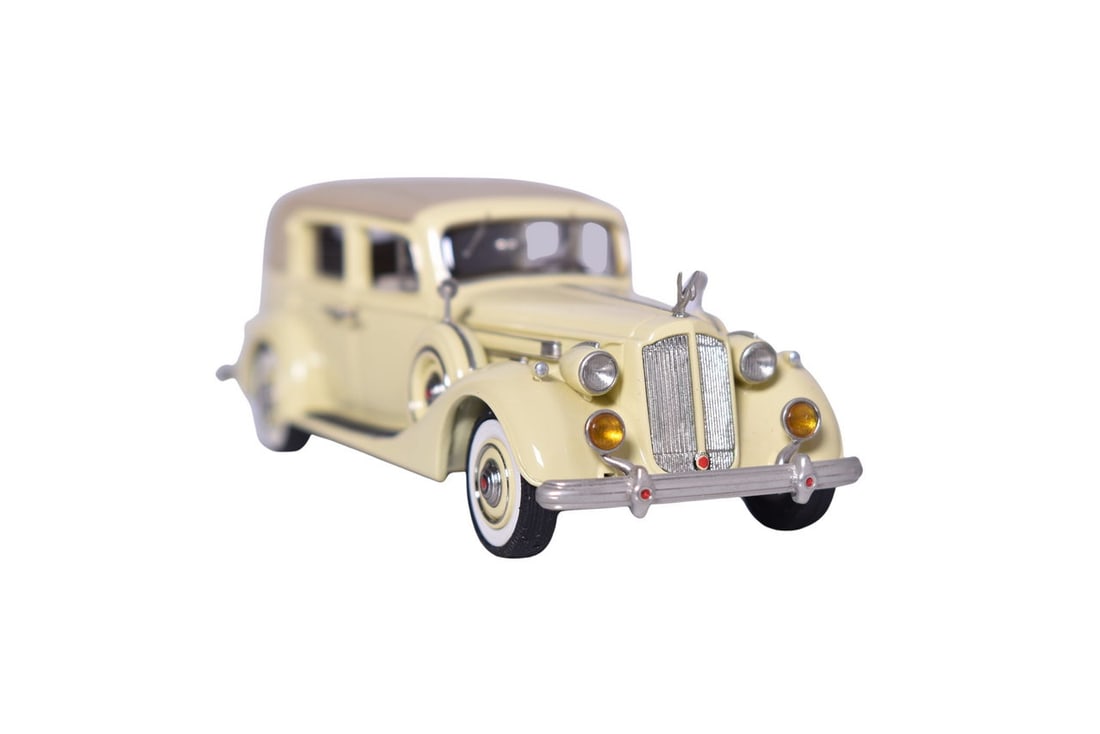 Motor City 1937 Packard Formal Sedan - Yellow: Motor City USA 1:43 white metal 1937 Packard Formal sedan in yellow with a tan top. No box for the car, but otherwise in good condition with only one noted detached detail part which is included in a