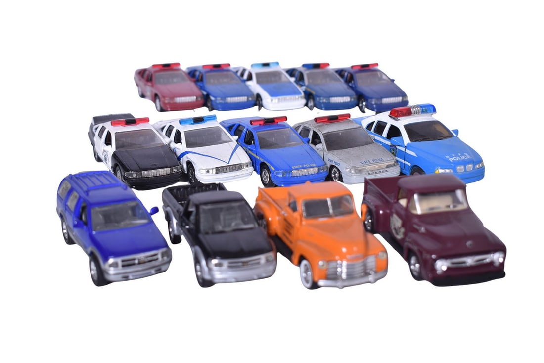 14 Road Champs Models: Fourteen Road Champs diecast 1:43 scale models. Includes 8 Chevrolet Caprice Police Car, Chevrolet S-10 ZR2, Chevrolet Blazer, Ford Crown Victoria Police Car, 1956 Ford F100, Chevrolet C3100, and an u