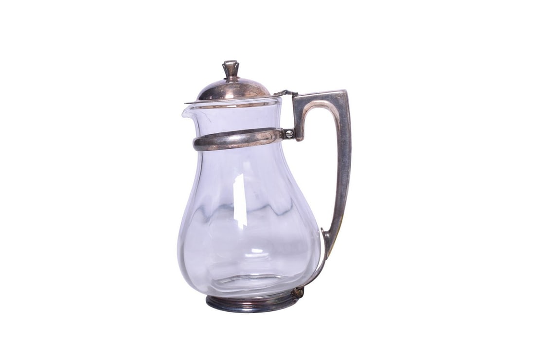 Norfolk and Western Railroad R. Wallace Silver Glass Water Carafe Pitcher: A large glass water carafe for Norfolk and Western Railroad, with silver frame and hinged lid. The bottom of the handle is stamped R. Wallace 0389T Norfolk & Western in cursive. Measures approximately