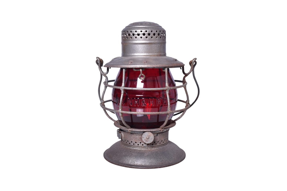 Dietz No. 39 New Haven Railway Bell Bottom Lantern w/ New York, New Haven & Hartford Globe: Dietz No. 39 bell bottom lantern with NH Ry embossed on the shoulder. Lantern has moderate pitting and some spots of rust, yet presents well. Burner pot and fount are present. The tall red CNX globe h
