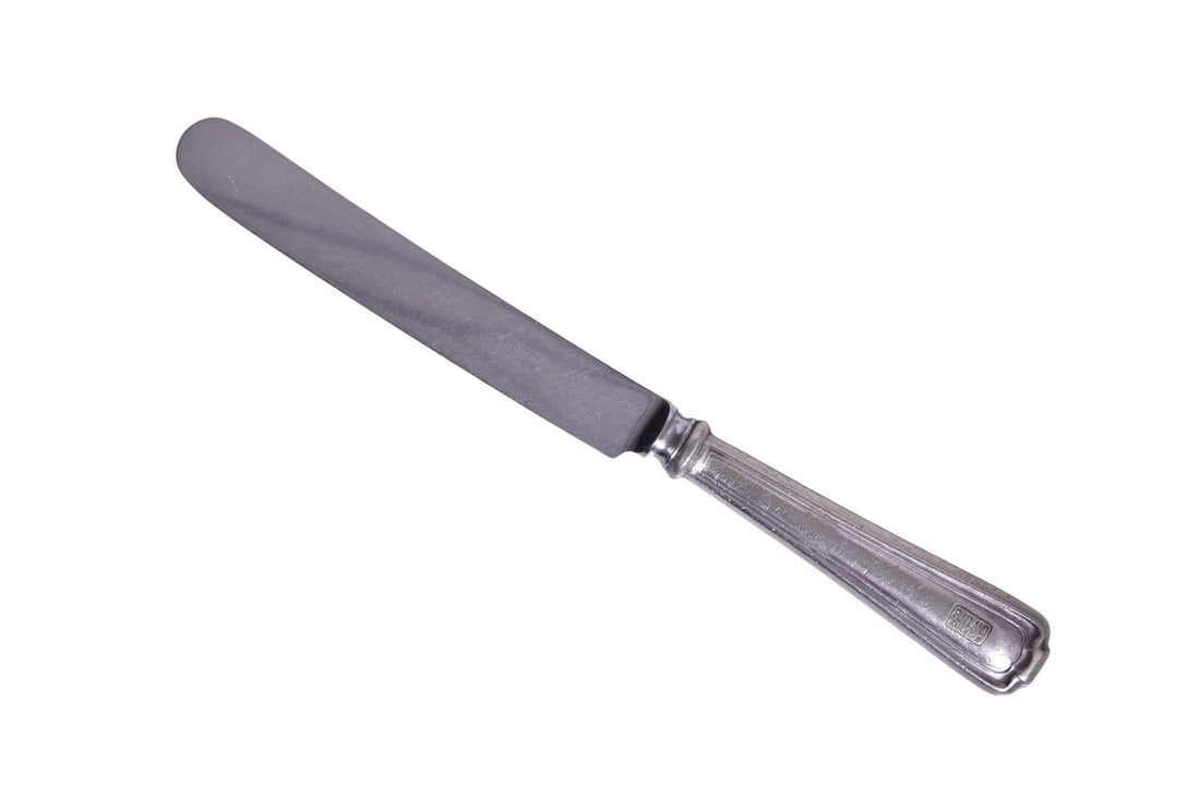Rutland Railroad International Silver Dinner Knife: A 9 7/8" dinner knife for the Rutland Railroad marked with the Rutland Railroad box logo on the handle and INSICO Stainless on the blade. The flatware shows general use with scratches, nicks, dings on