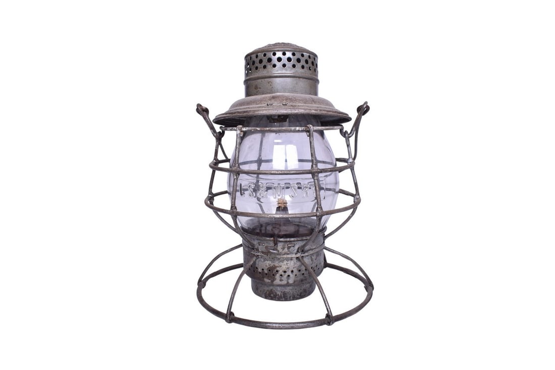 Adams & Westlake Lake Shore and Michigan Southern Railroad Lantern With Cast Globe: Adams & Westlake lantern with LS&MS Ry embossed on the shoulder. Latest patent date on the shoulder rim reads Jan 26, 1909. Double-wire guard lantern body is in good condition with a broken off lid la