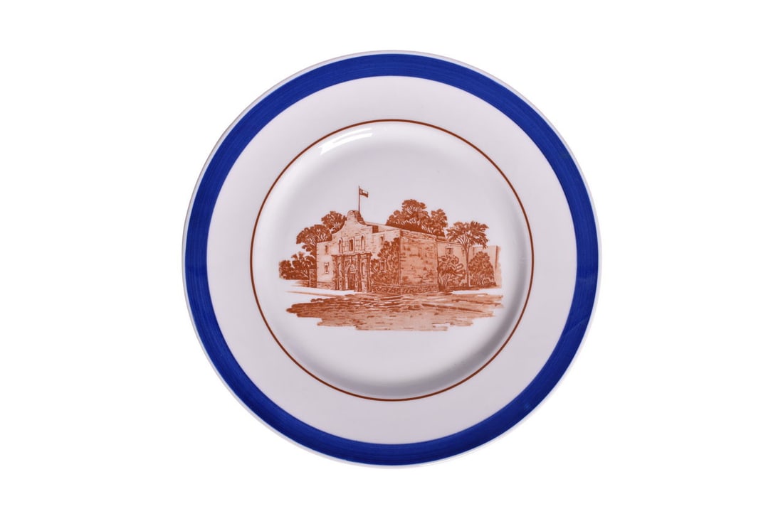 Missouri, Kansas, & Texas Railroad China Alamo Blue Service Plate 10 3/4": A 10 3/4" china service plate for the Missouri, Kansas, & Texas Railroad in the Alamo Blue design. The plate features a cobalt blue outer band, inner brown pinstripe, and brown center graphic. Back is