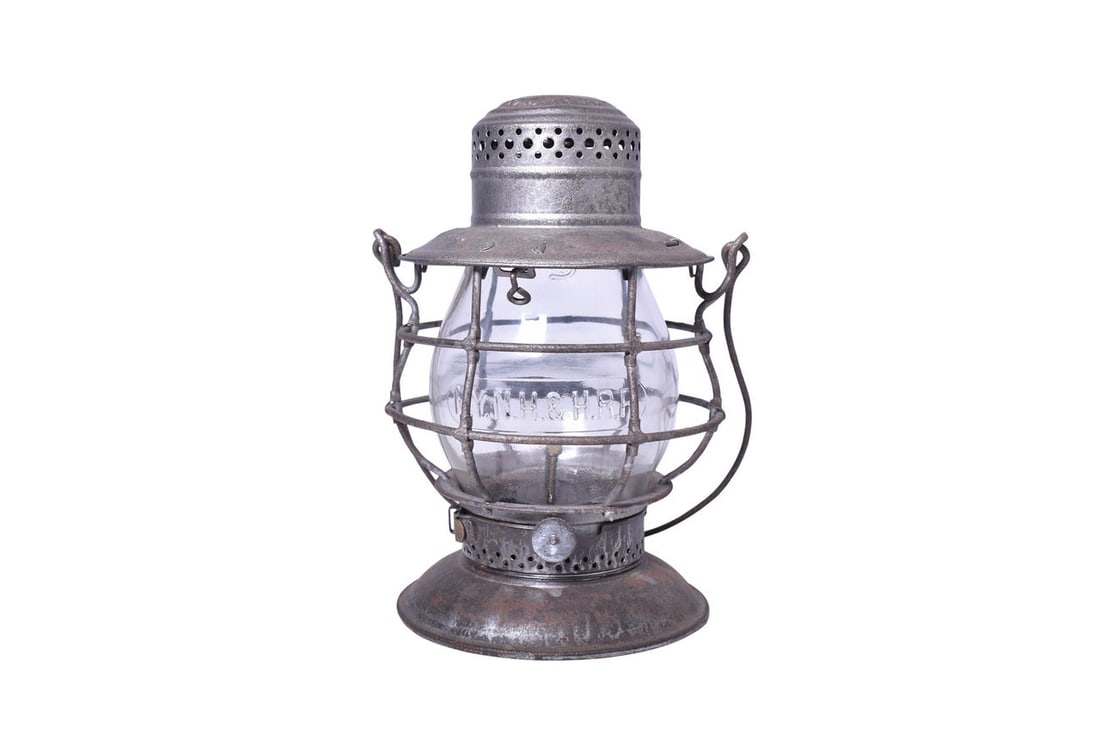 Dietz No. 39 New York, New Haven & Hartford Railroad Bell Bottom Lantern w/ Clear Cast Globe: Dietz No. 39 bell bottom lantern with NYNH&H RR embossed on the shoulder. Lantern has a dent in the chimney top and some mild rust and pitting. Burner pot and fount are present. The tall clear CNX glo