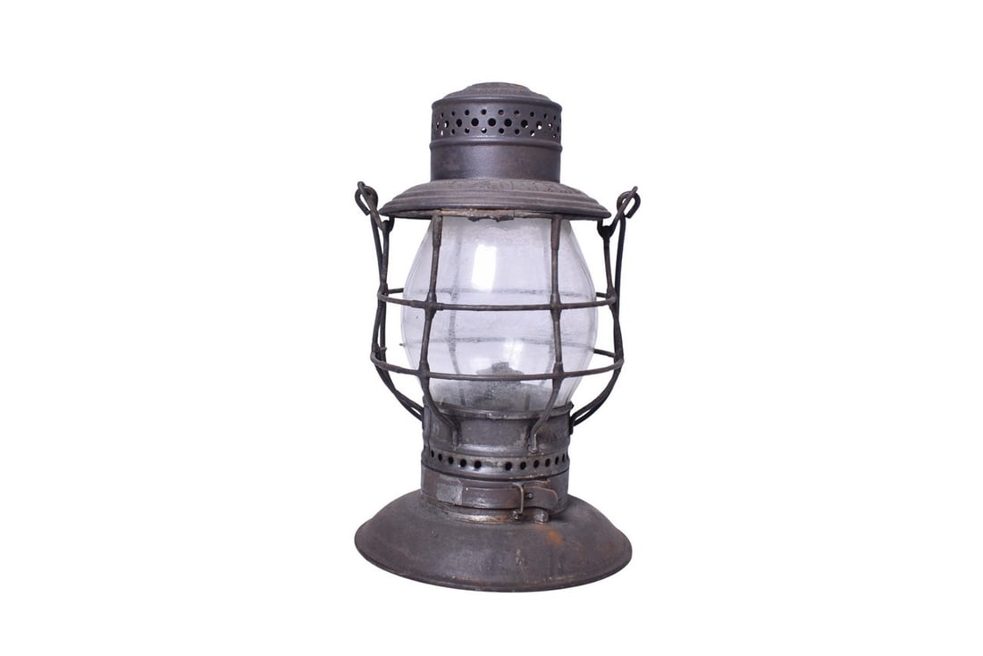 Adams & Westlake Chicago and North Western Railroad Bell Bottom Lantern: Adams & Westlake bell bottom lantern with C&NW RR embossed on the shoulder. Lantern is missing its lid latch and has a couple spots of rust. Burner pot and fount are present. Tall clear CNX globe has