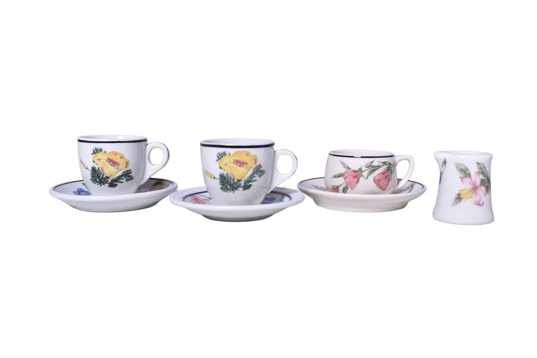 Southern Pacific Railroad China Prairie Mountain Wildflowers Cups, Saucers, and Creamer: Seven pieces of Southern Pacific Railroad dining car china in the Prairie Mountain Wildflowers pattern by Syracuse. The most notable piece is a 2 1/4" demitasse cup bottom marked with the Farewell to
