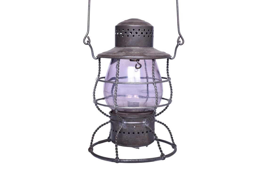 Defiance Grand Rapids and Indiana Railroad Lantern: Double-wire guard lantern with twisted wire supports, likely a Defiance lantern, with GR&I embossed on the shoulder. Lantern body is in very good condition with a small dent on the shoulder below the