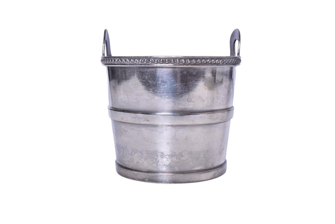Reed & Barton Baltimore and Ohio Railroad Silver Champagne Ice Bucket: A champagne ice bucket with handles for the Baltimore and Ohio Railroad, bottom stamped B&O in cursive Reed & Barton 2955-S. Measures 6 3/4" tall at the handles and 6 1/2" diameter. Bucket shows gener