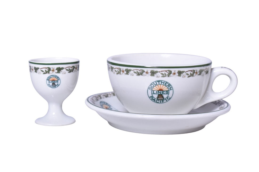 Southern Pacific Railroad China Sunset Egg Cup, Tea Cup, and Saucer: Set of dining car items for the Southern Pacific Lines in the Sunset pattern by Syracuse. Includes a 2 3/8" tall pedestal egg cup, no manufacturers mark, showing no use. A 3 7/8" diameter by 2 1/4"