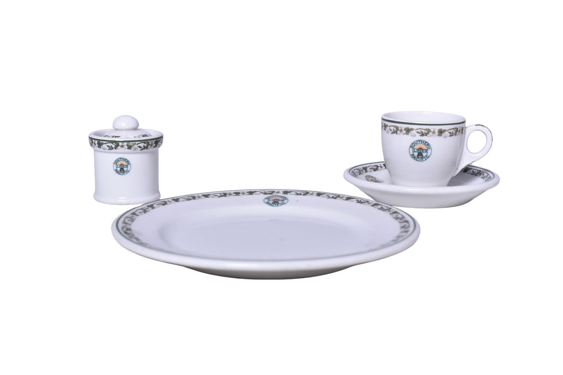 Group of Southern Pacific Railroad China Sunset Mustard Pot, Demitasse Set, and Bread Plate: Four dining car items for the Southern Pacific Railroad marked with the Sunset logo. Includes a 2 1/2" tall mustard pot with notched lid by Syracuse G-6, showing minimal use but light discoloration al